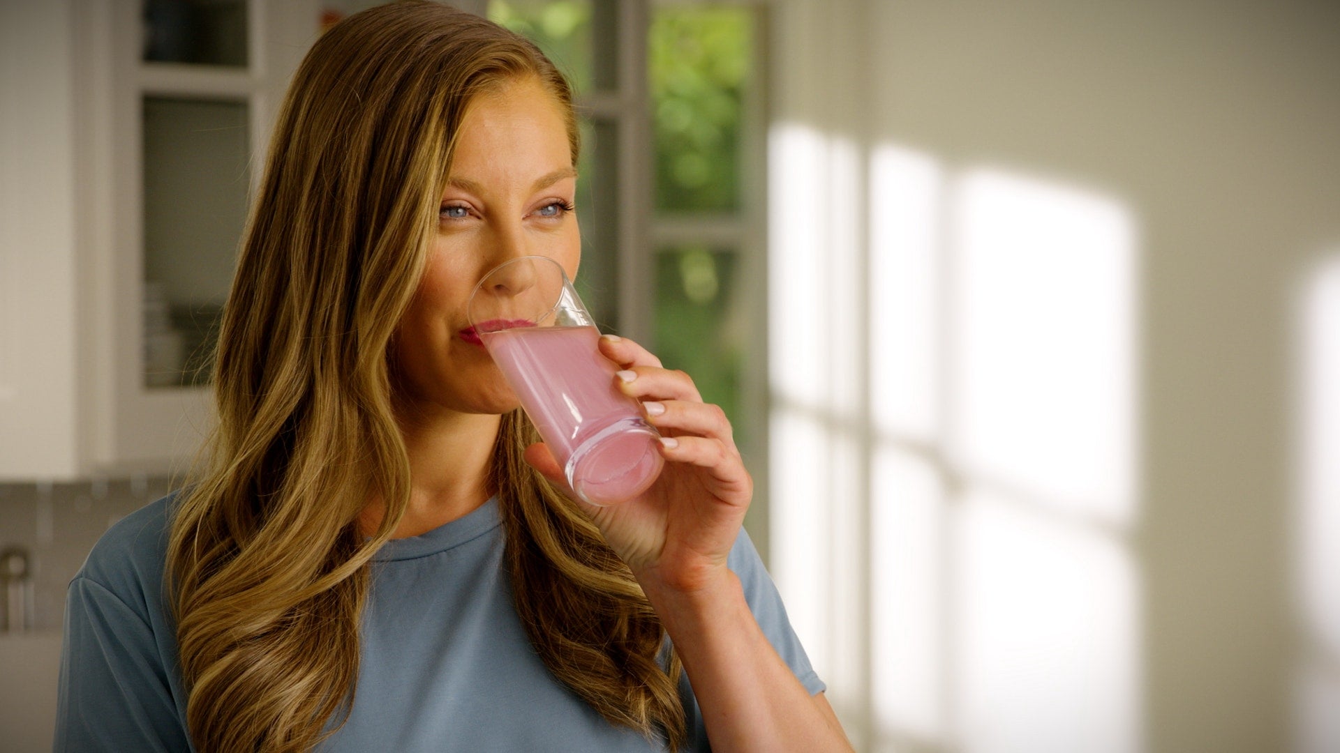 A girl drinking rose water